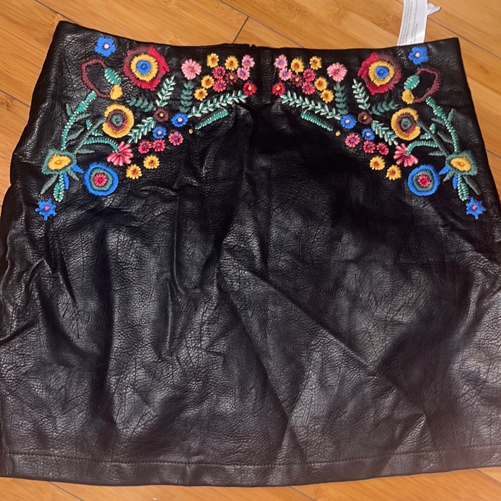 Faux black leather with embroidered flowers